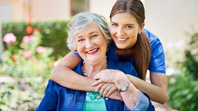 Happy Senior with Staff Member